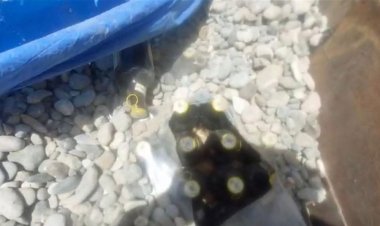 بغداد.. ضبط "تريلة" محملة بمشروبات كحولية مخبأة تحت "حصى"